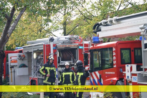 Bewoner afgevoerd na woningbrand